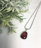 red tigers eye pendant
