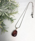 red tigers eye pendant
